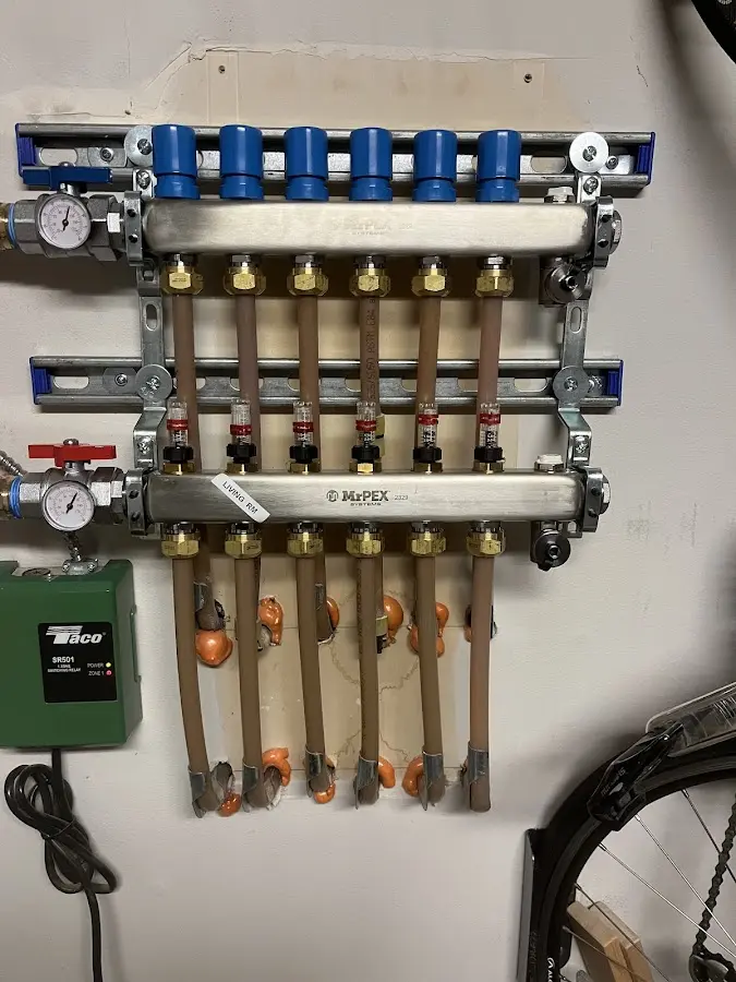 Plumber performing Water Heater Repair at a residential property in Newton Falls